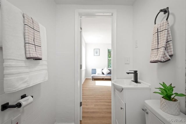 215 S S St, Petersburg, VA 23803 - bathroom featuring wood finished floors, vanity, and toilet