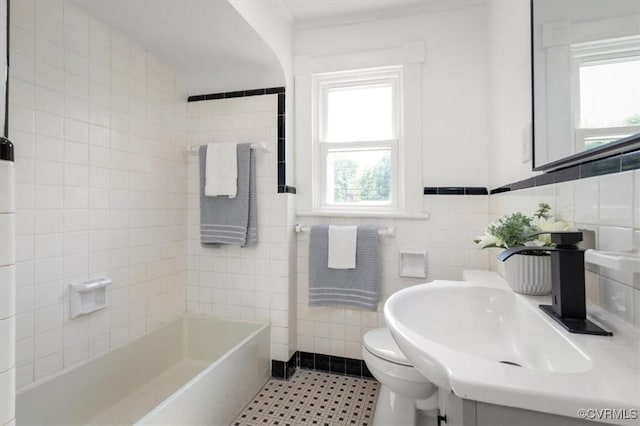 215 S S St, Petersburg, VA 23803 - full bath with tile walls, toilet, vanity, and tile patterned floors