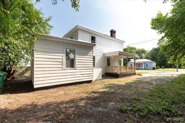 215 S S St, Petersburg, VA 23803 - view of side of home with a chimney