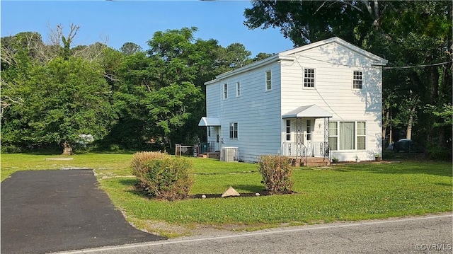 1718 Youngs Rd, Petersburg, VA 23803 - view of front of house featuring a front yard, driveway, and central air condition unit