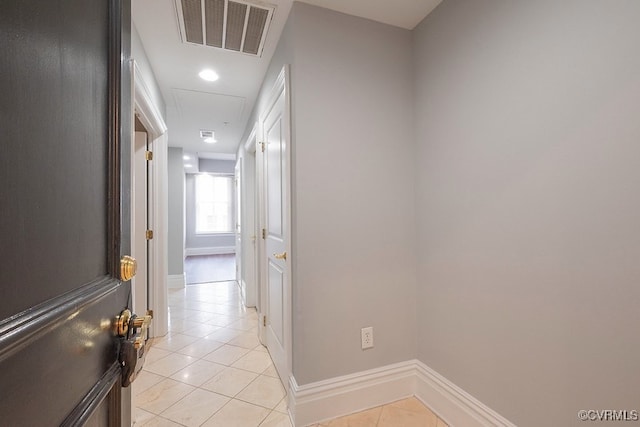 6 N 6th St Unit U3C, Richmond, VA 23219 - hall featuring light tile patterned floors, baseboards, and attic access