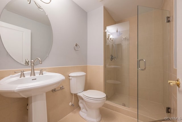 6 N 6th St Unit U3C, Richmond, VA 23219 - full bathroom featuring toilet, a shower stall, tile patterned flooring, and tile walls