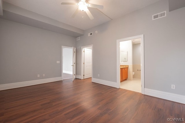 6 N 6th St Unit U3C, Richmond, VA 23219 - unfurnished bedroom with wood finished floors, baseboards, ensuite bath, and ceiling fan
