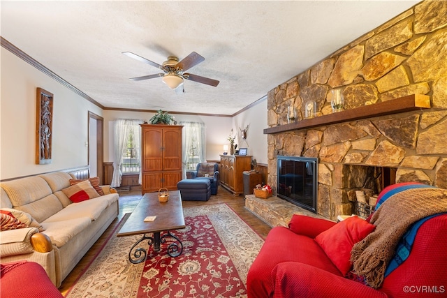 14000 Autumn Woods Rd, Midlothian, VA 23112 - living area featuring wood finished floors, crown molding, a ceiling fan, a stone fireplace, and a textured ceiling
