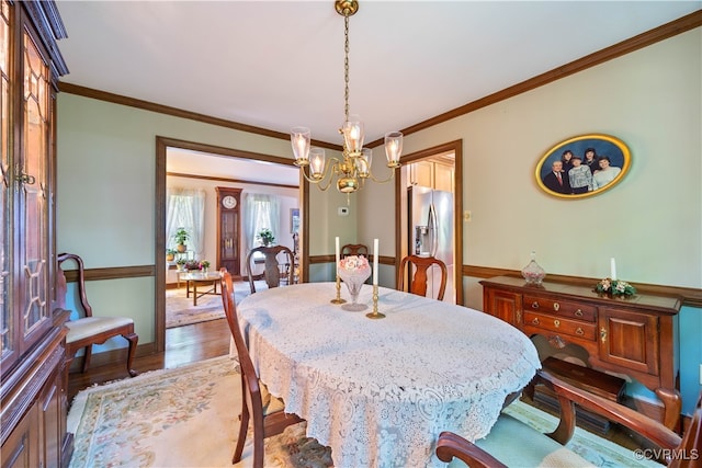 14000 Autumn Woods Rd, Midlothian, VA 23112 - dining space featuring wood finished floors, a chandelier, and ornamental molding
