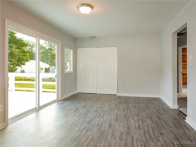 5810 Gunsight Ct, North Chesterfield, VA 23237 - unfurnished bedroom with access to outside, baseboards, wood finished floors, and a closet