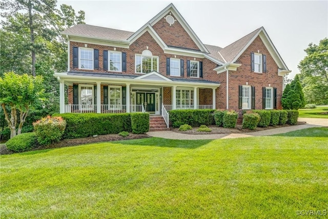 4307 Wilcot Dr, Midlothian, VA 23113 - colonial home with brick siding, a front lawn, and a porch