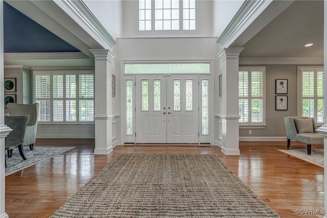 4307 Wilcot Dr, Midlothian, VA 23113 - entrance foyer featuring decorative columns, crown molding, baseboards, and wood finished floors