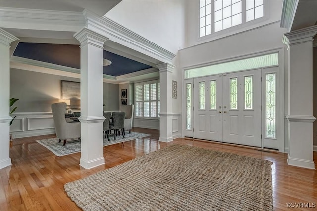 4307 Wilcot Dr, Midlothian, VA 23113 - entryway with ornate columns, wood finished floors, a decorative wall, crown molding, and wainscoting