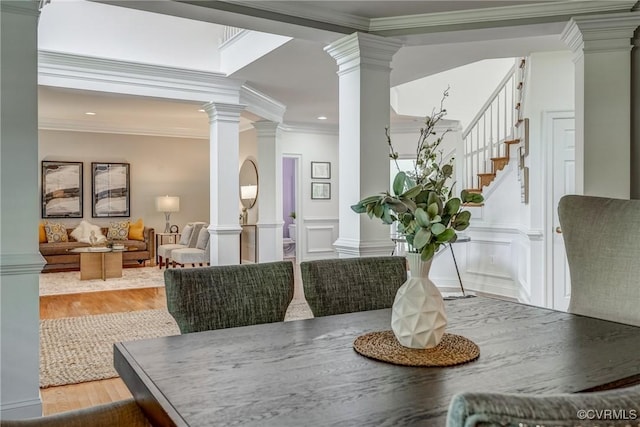 4307 Wilcot Dr, Midlothian, VA 23113 - dining room featuring decorative columns, wood finished floors, crown molding, recessed lighting, and stairway