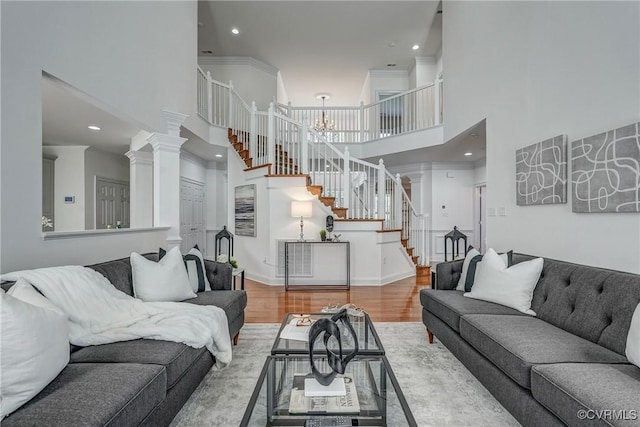 4307 Wilcot Dr, Midlothian, VA 23113 - living area with stairway, a towering ceiling, wood finished floors, recessed lighting, and a chandelier