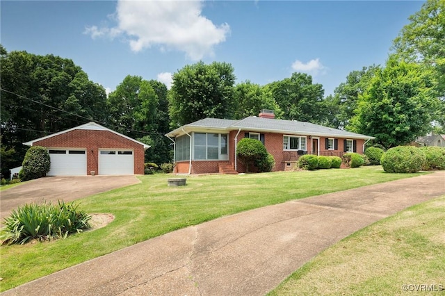 4212 Randolph Rd, North Chesterfield, VA 23236 - view of front facade with brick siding, an outbuilding, a garage, and a front lawn