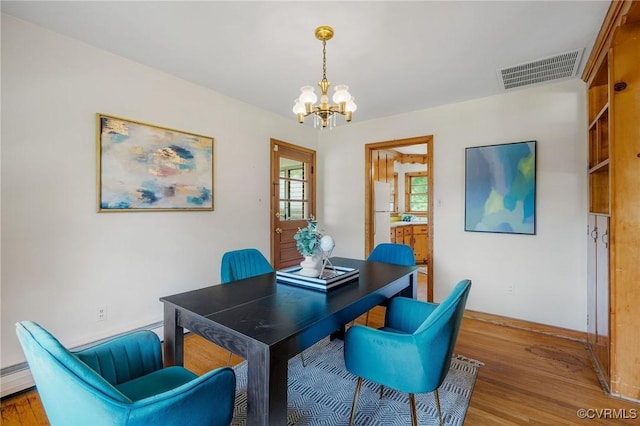 4212 Randolph Rd, North Chesterfield, VA 23236 - dining area with a chandelier, light wood-style flooring, and a baseboard radiator