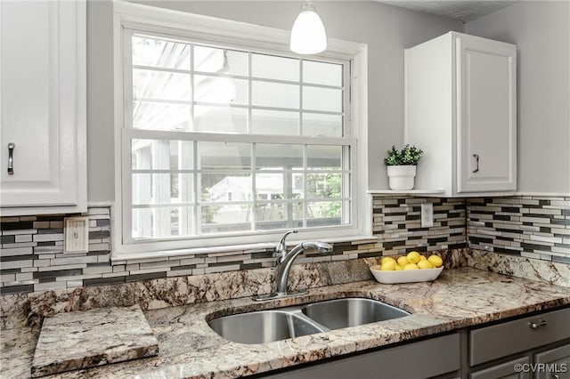 6406 Lothaire Ct, North Chesterfield, VA 23234 - kitchen featuring a sink, white cabinetry, and decorative backsplash