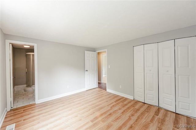 6406 Lothaire Ct, North Chesterfield, VA 23234 - unfurnished bedroom with light wood-style floors, baseboards, a closet, and connected bathroom