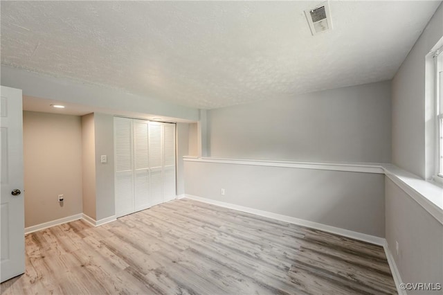 6406 Lothaire Ct, North Chesterfield, VA 23234 - unfurnished bedroom with wood finished floors, a closet, baseboards, a textured ceiling, and recessed lighting