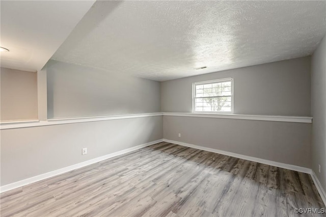 6406 Lothaire Ct, North Chesterfield, VA 23234 - empty room featuring a textured ceiling, wood finished floors, and baseboards