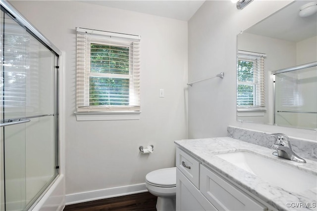 12410 Creek Mill Ct, Glen Allen, VA 23059 - bathroom featuring vanity, wood finished floors, and combined bath / shower with glass door