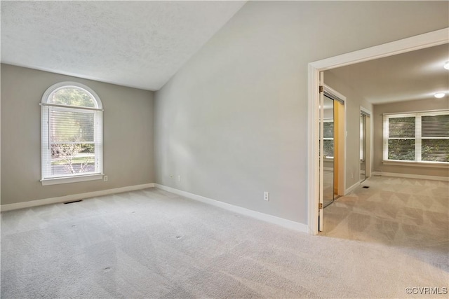 12410 Creek Mill Ct, Glen Allen, VA 23059 - carpeted empty room with lofted ceiling and a textured ceiling