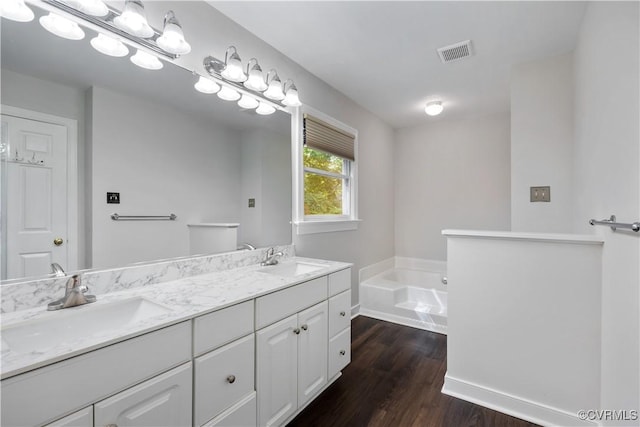 12410 Creek Mill Ct, Glen Allen, VA 23059 - full bathroom featuring wood finished floors, a bath, and double vanity