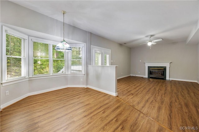 12410 Creek Mill Ct, Glen Allen, VA 23059 - unfurnished living room with wood finished floors, ceiling fan, and a fireplace with flush hearth