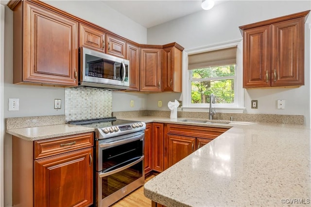 12410 Creek Mill Ct, Glen Allen, VA 23059 - kitchen with appliances with stainless steel finishes and brown cabinets