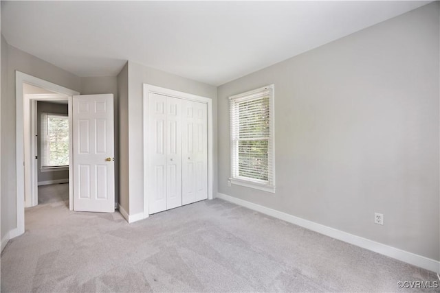 12410 Creek Mill Ct, Glen Allen, VA 23059 - unfurnished bedroom with carpet floors, multiple windows, and a closet