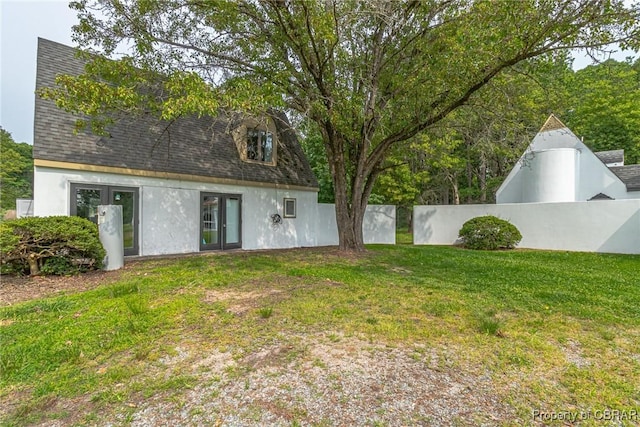 1083 Ottoman Ferry Rd, Mollusk, VA 22503 - view of yard featuring french doors
