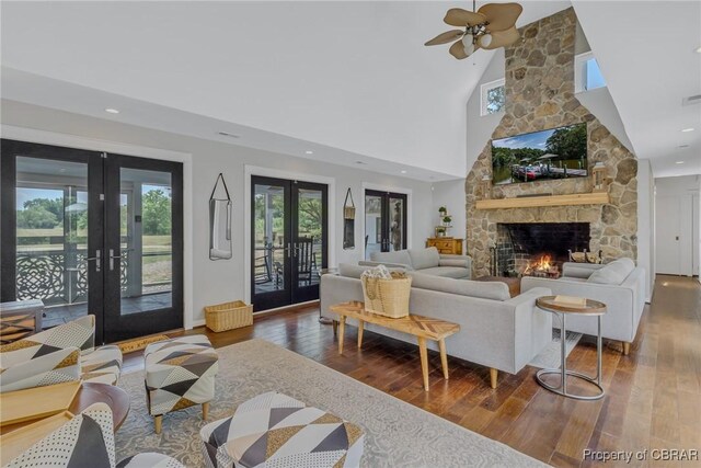 1083 Ottoman Ferry Rd, Mollusk, VA 22503 - living area featuring french doors, plenty of natural light, hardwood / wood-style floors, a towering ceiling, and recessed lighting