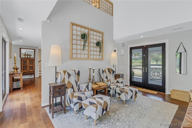 1083 Ottoman Ferry Rd, Mollusk, VA 22503 - living area with french doors, wood finished floors, and recessed lighting
