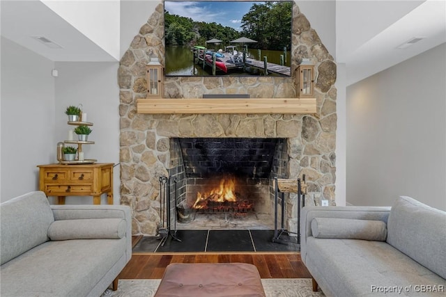 1083 Ottoman Ferry Rd, Mollusk, VA 22503 - living area featuring a fireplace and wood finished floors