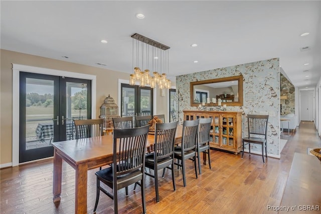 1083 Ottoman Ferry Rd, Mollusk, VA 22503 - dining space with french doors, light wood-style flooring, wallpapered walls, recessed lighting, and baseboards