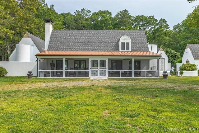 1083 Ottoman Ferry Rd, Mollusk, VA 22503 - back of house with a standing seam roof, a sunroom, and metal roof
