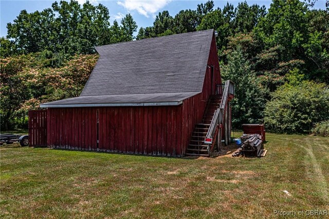 1083 Ottoman Ferry Rd, Mollusk, VA 22503 - view of barn with a lawn and stairway