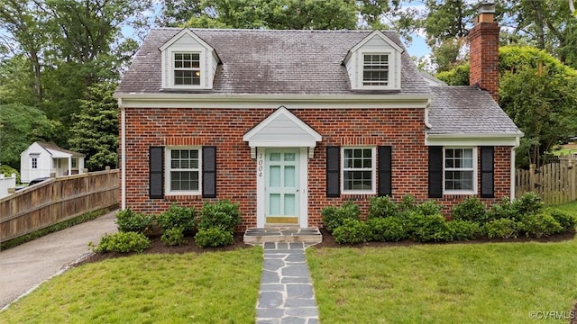 1004 Dinwiddie Ave, Henrico, VA 23229 - cape cod-style house with brick siding and a chimney