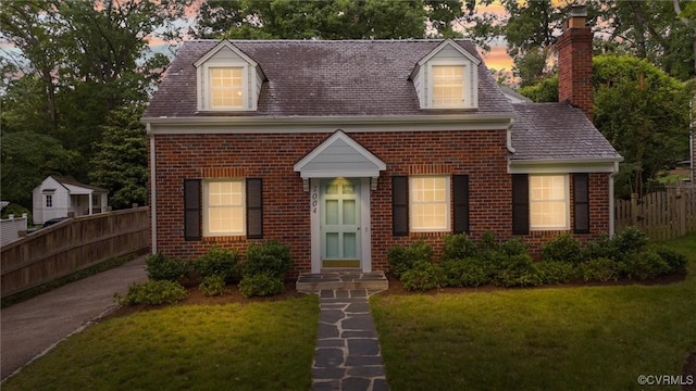 1004 Dinwiddie Ave, Henrico, VA 23229 - new england style home featuring brick siding and a chimney