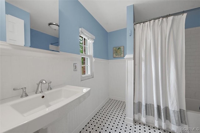 1004 Dinwiddie Ave, Henrico, VA 23229 - bathroom with wainscoting, a sink, and shower / tub combo with curtain