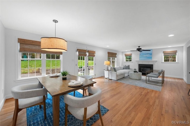 1004 Dinwiddie Ave, Henrico, VA 23229 - dining area featuring baseboards, light wood finished floors, a glass covered fireplace, a ceiling fan, and recessed lighting