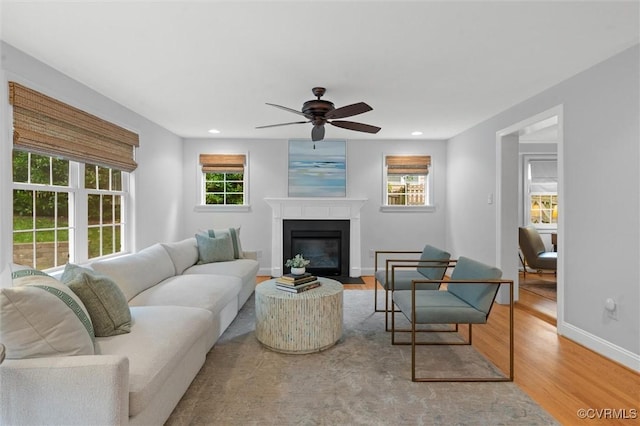 1004 Dinwiddie Ave, Henrico, VA 23229 - living room featuring wood finished floors, ceiling fan, a fireplace with flush hearth, baseboards, and recessed lighting