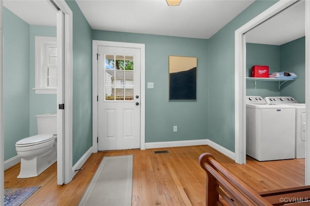 1004 Dinwiddie Ave, Henrico, VA 23229 - foyer with independent washer and dryer, light wood-style floors, and baseboards