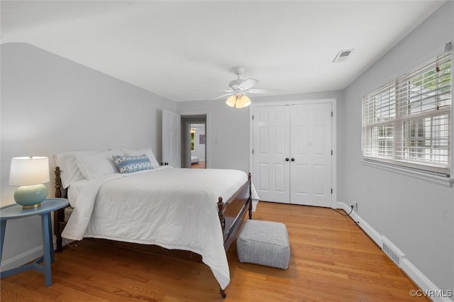 1004 Dinwiddie Ave, Henrico, VA 23229 - bedroom featuring light wood-type flooring, a closet, a ceiling fan, and baseboards