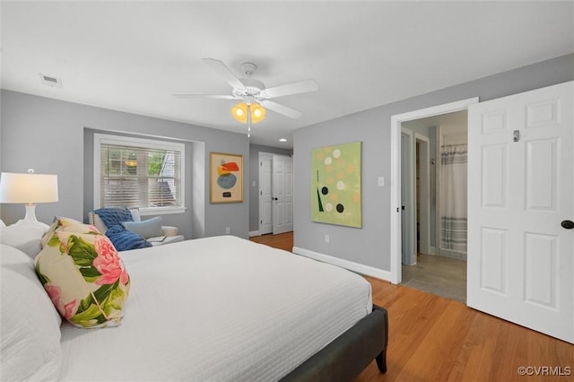 1004 Dinwiddie Ave, Henrico, VA 23229 - bedroom featuring baseboards, light wood-type flooring, a ceiling fan, and connected bathroom