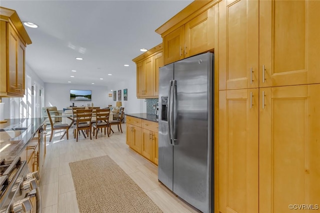 1222 Hull Harbor Rd, Heathsville, VA 22473 - kitchen with stainless steel fridge with ice dispenser, dark stone countertops, recessed lighting, wall oven, and tasteful backsplash