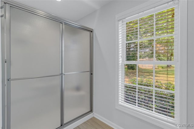 1222 Hull Harbor Rd, Heathsville, VA 22473 - full bathroom with a shower with shower door and wood finished floors