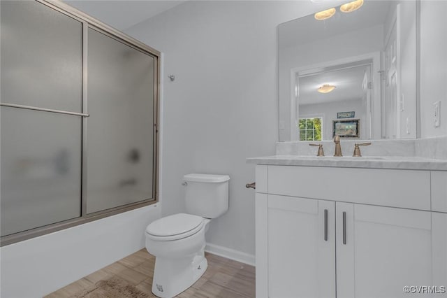 1222 Hull Harbor Rd, Heathsville, VA 22473 - bathroom featuring vanity, bath / shower combo with glass door, and wood finished floors
