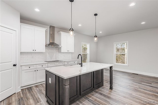 LOT10 Whartons Pass, Orange, VA 22567 - kitchen featuring wall chimney range hood, light wood-style flooring, healthy amount of natural light, backsplash, and recessed lighting