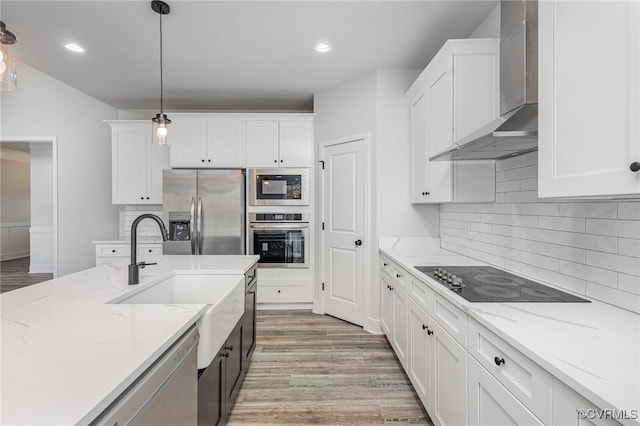 LOT10 Whartons Pass, Orange, VA 22567 - kitchen featuring black appliances, wall chimney range hood, a sink, white cabinets, and recessed lighting