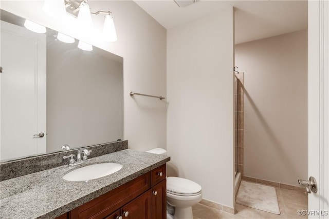 301 Virginia St Unit U806, Richmond, VA 23219 - bathroom featuring toilet, vanity, an enclosed shower, tile patterned flooring, and baseboards