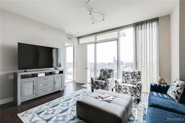 301 Virginia St Unit U806, Richmond, VA 23219 - living area featuring dark wood-type flooring and baseboards
