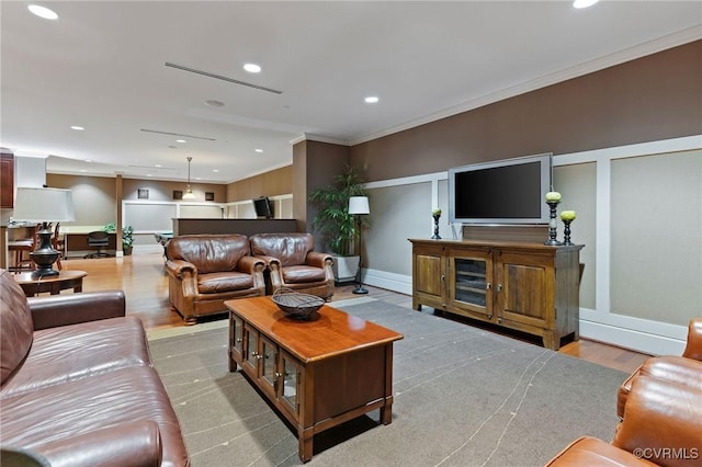 301 Virginia St Unit U806, Richmond, VA 23219 - living room featuring wood finished floors, crown molding, recessed lighting, and baseboards